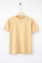 Beige t-shirt on a hanger against a white background