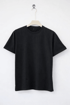 Black t-shirt on a hanger against a white background