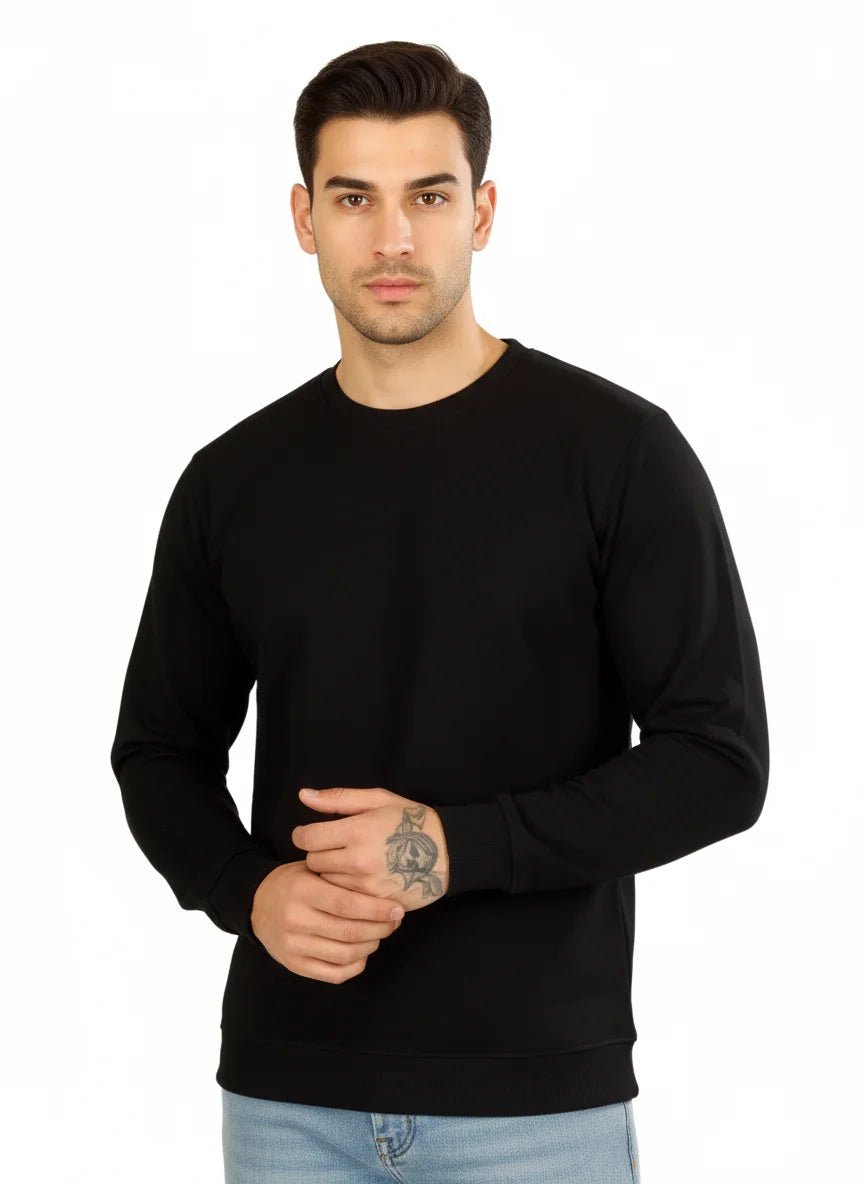 Man wearing a black sweater on a white background