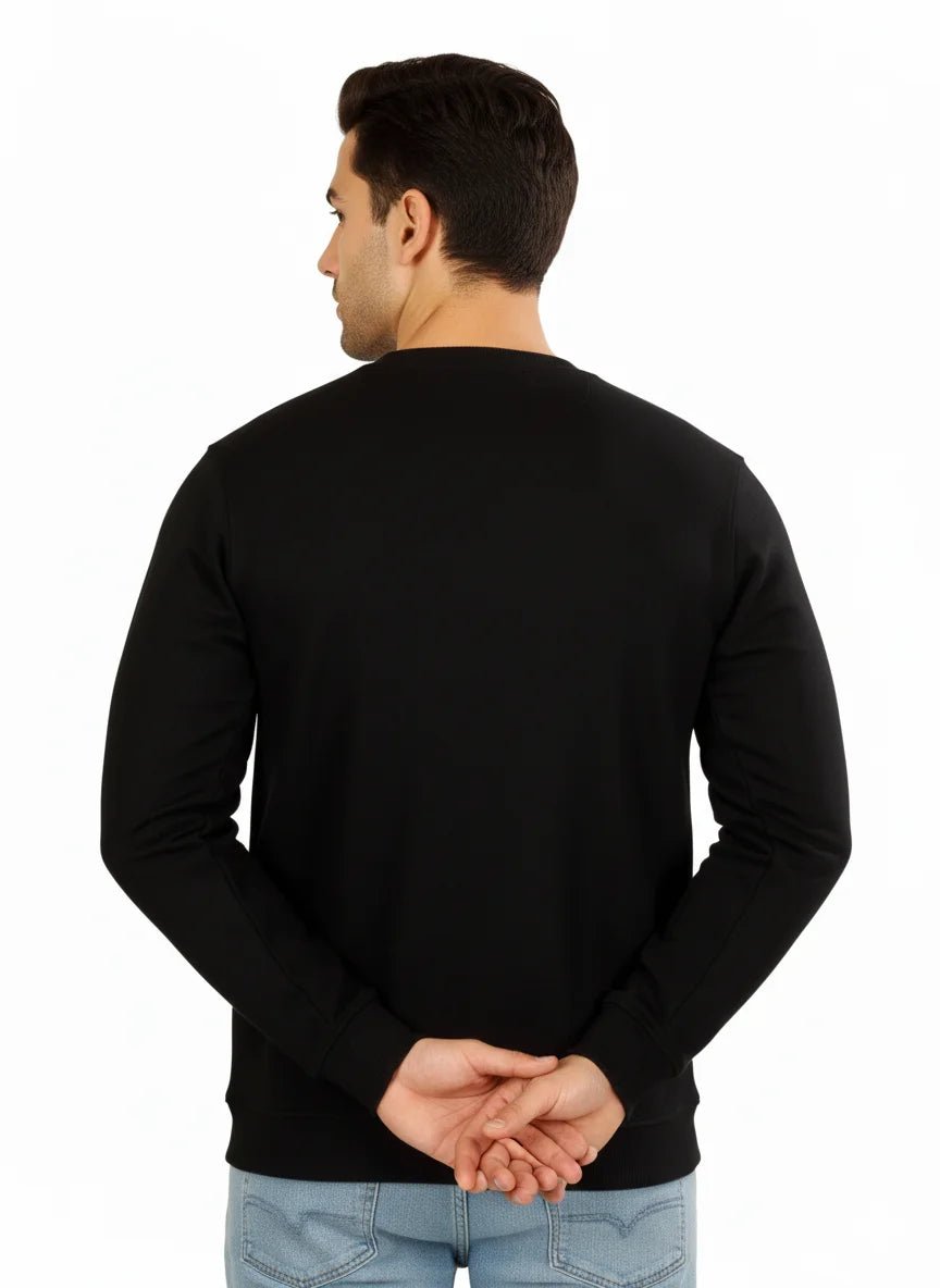 Man wearing a black sweater on a white background