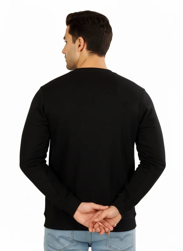 Man wearing a black sweater on a white background