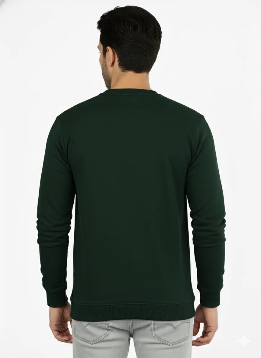 Man wearing a dark green long-sleeve shirt on a white background