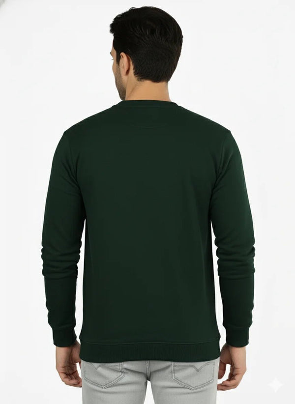 Man wearing a dark green long-sleeve shirt on a white background