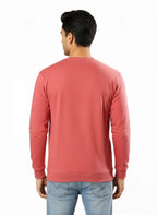 Person wearing a red sweatshirt on a white background