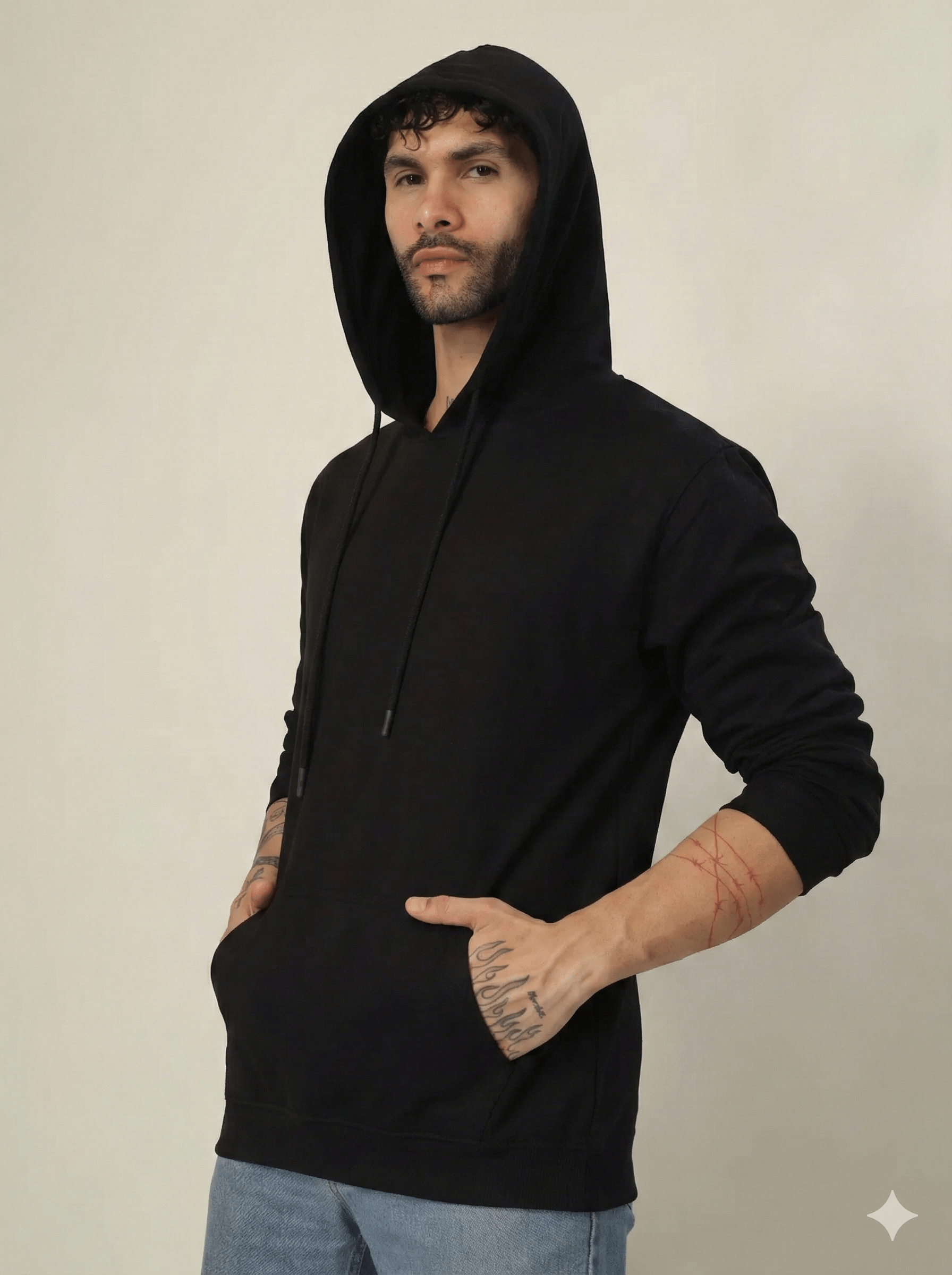 Man wearing a black hoodie against a plain background