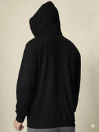 Black hoodie on a beige background