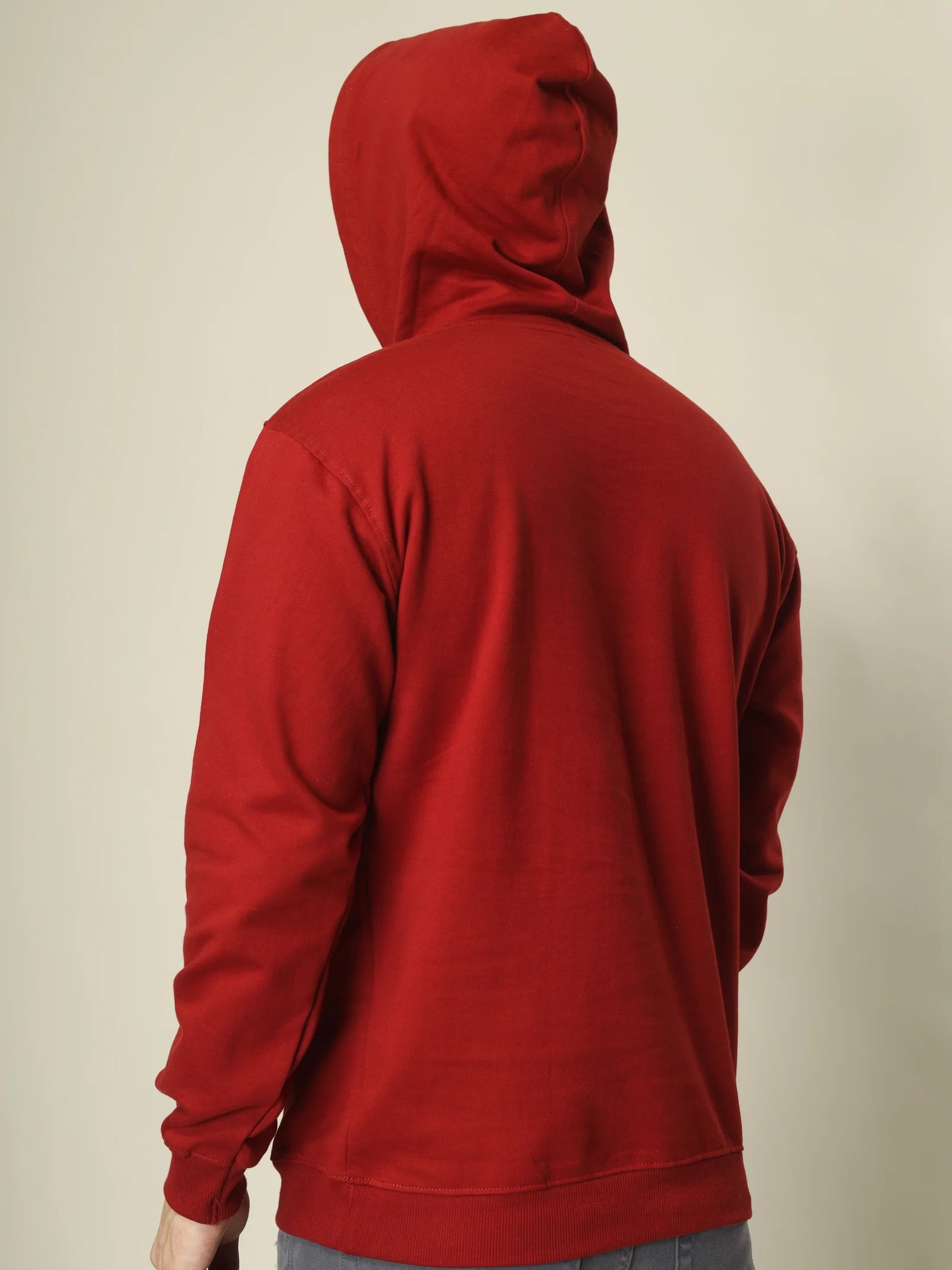 Red hoodie on a beige background