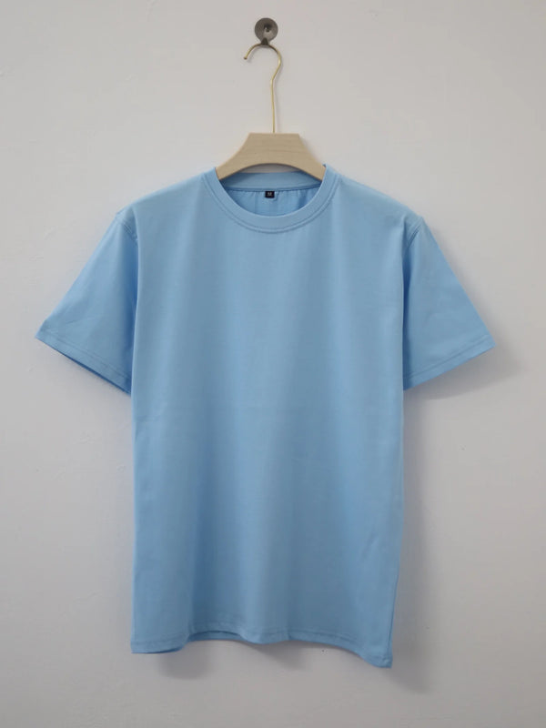 Plain light blue t-shirt on a hanger against a gray background